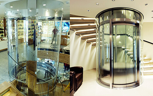 Runder Glasaufzug und Treppe